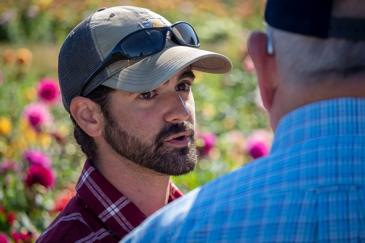 A grower speaking in a dahlia field at Summer Dreams Farm